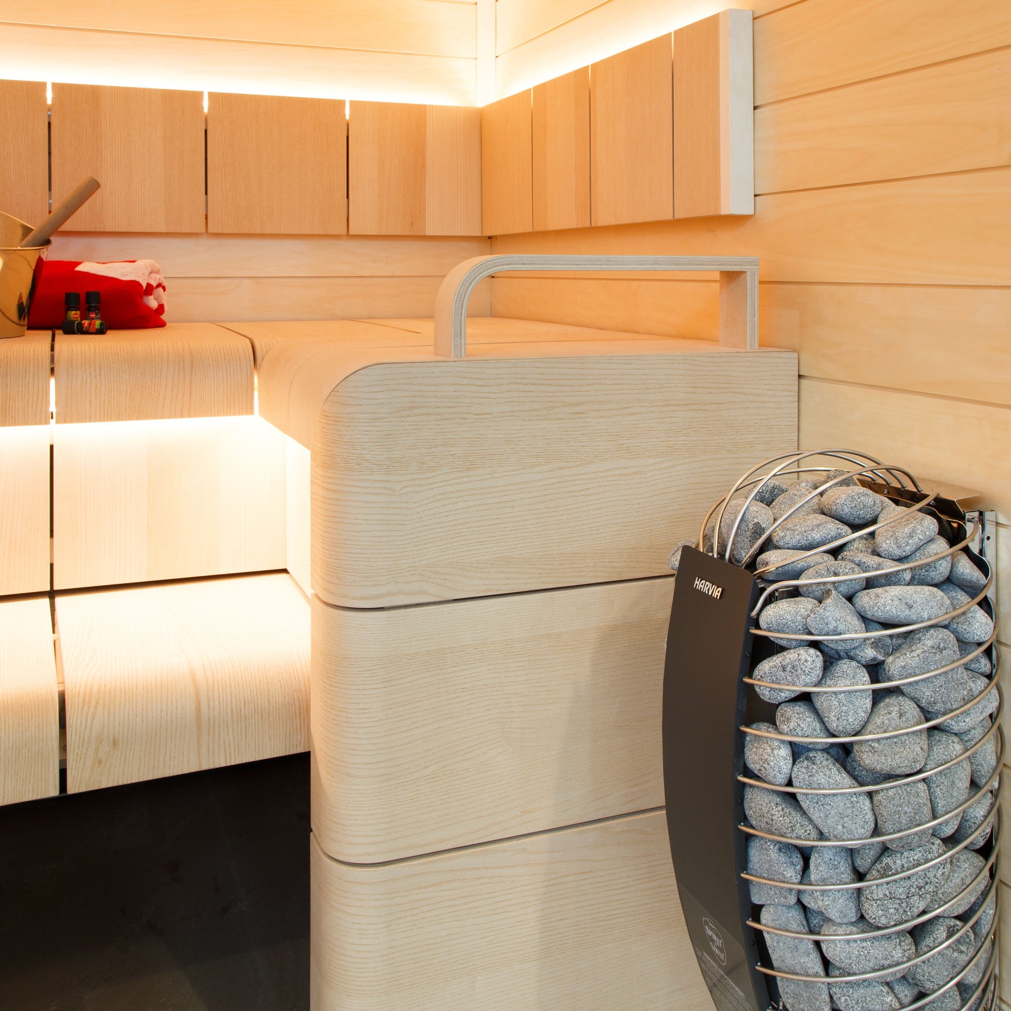 Harvia Spirit sauna heater in a sauna with warm white lighting