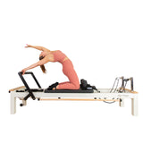 C8-S Pro reformer photographed from the side with a client seated