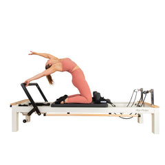 C8-S Pro reformer photographed from the side with a client seated