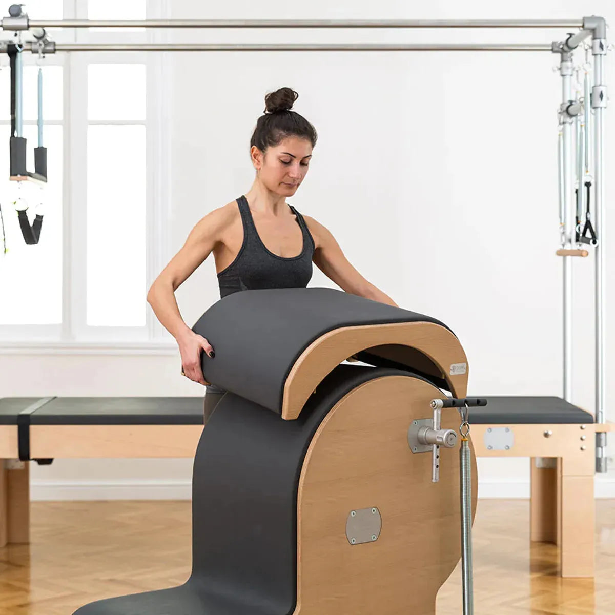 fit women removing saddle from BASI Systems Armchair Barrel Set
