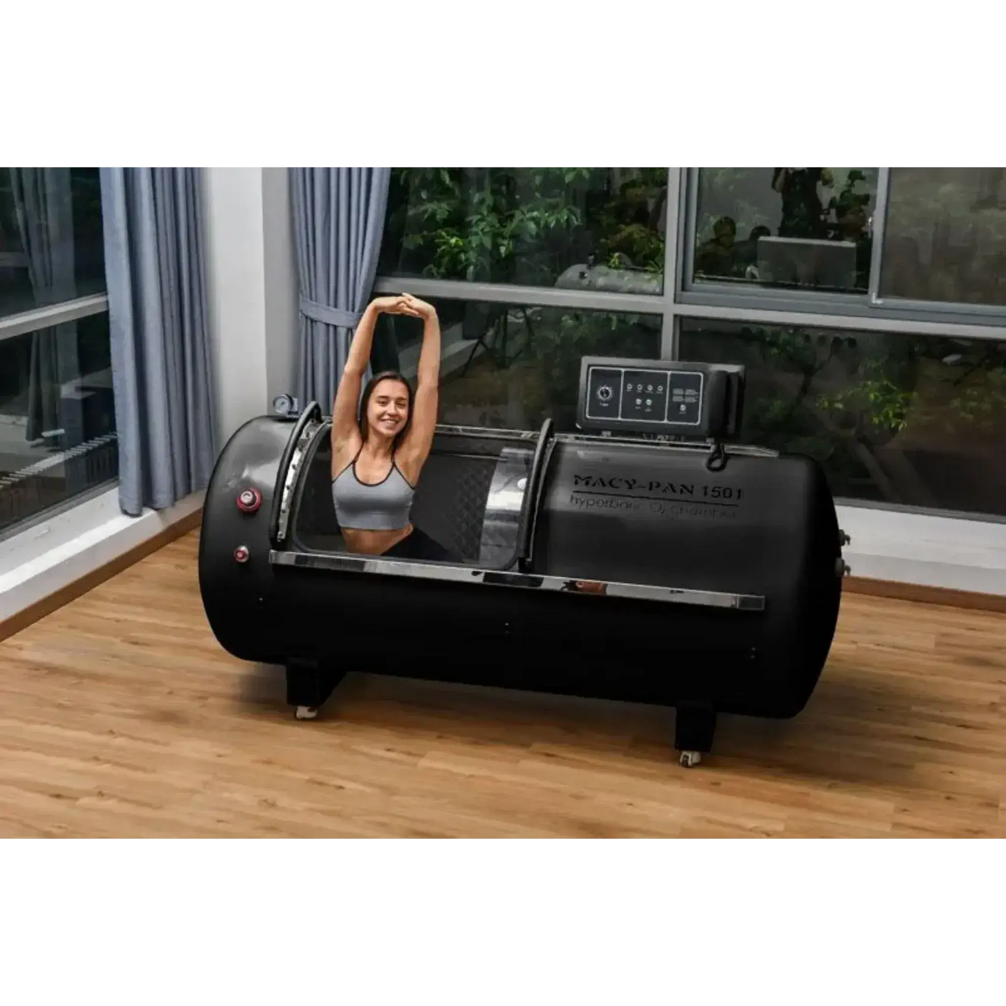 Macy-Pan 1501 Hyperbaric Chamber showcasing a woman stretching inside for oxygen therapy and recovery.