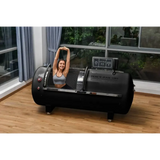 Macy-Pan 1501 Hyperbaric Chamber showcasing a woman stretching inside for oxygen therapy and recovery.