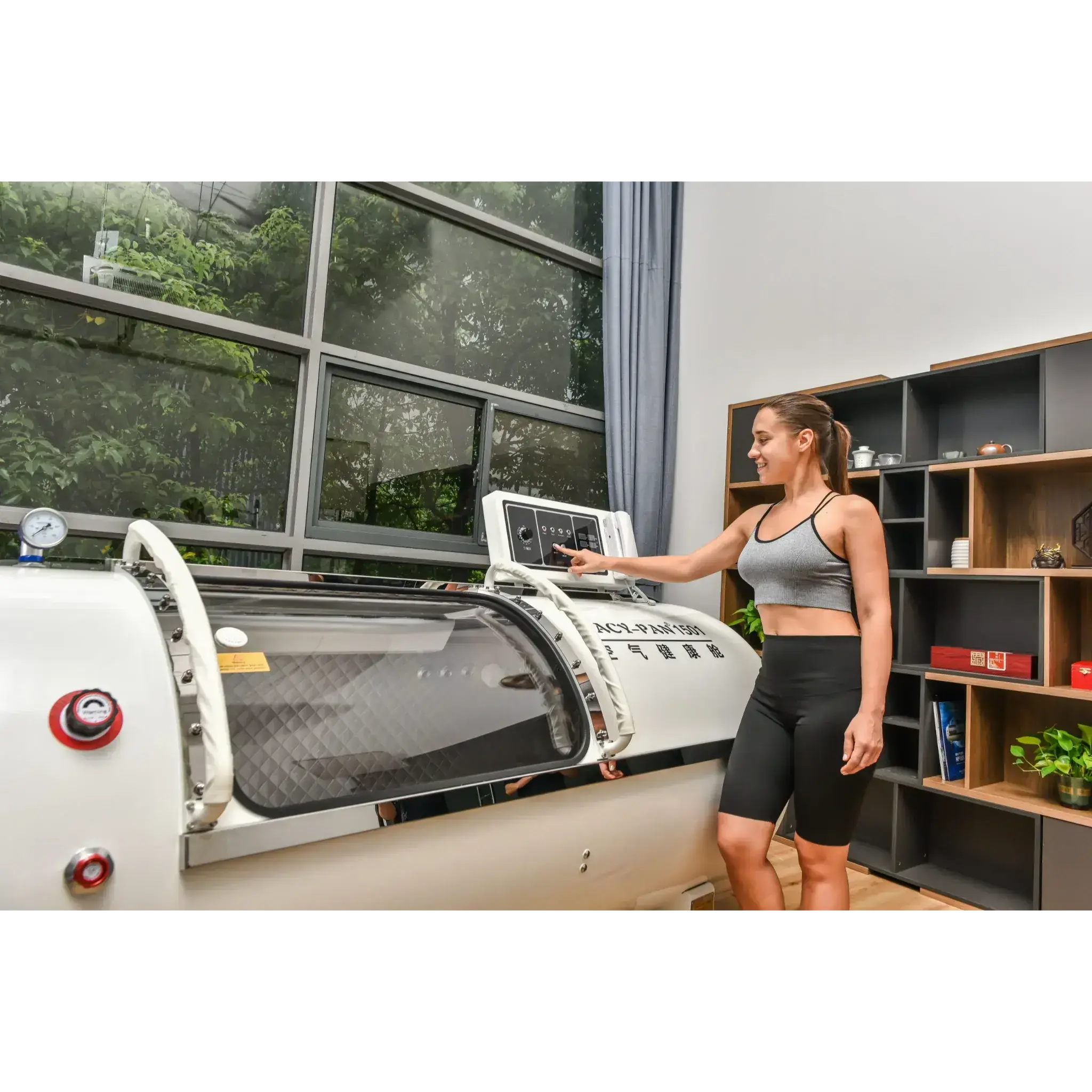 Woman using Macy-Pan HP1501 Hyperbaric Oxygen Therapy Chamber for enhanced recovery and well-being.
