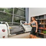 Woman using Macy-Pan HP1501 Hyperbaric Oxygen Therapy Chamber for enhanced recovery and well-being.