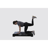 Female Model doing stretches on VibePlate 2440 Whole Body Vibration Machines