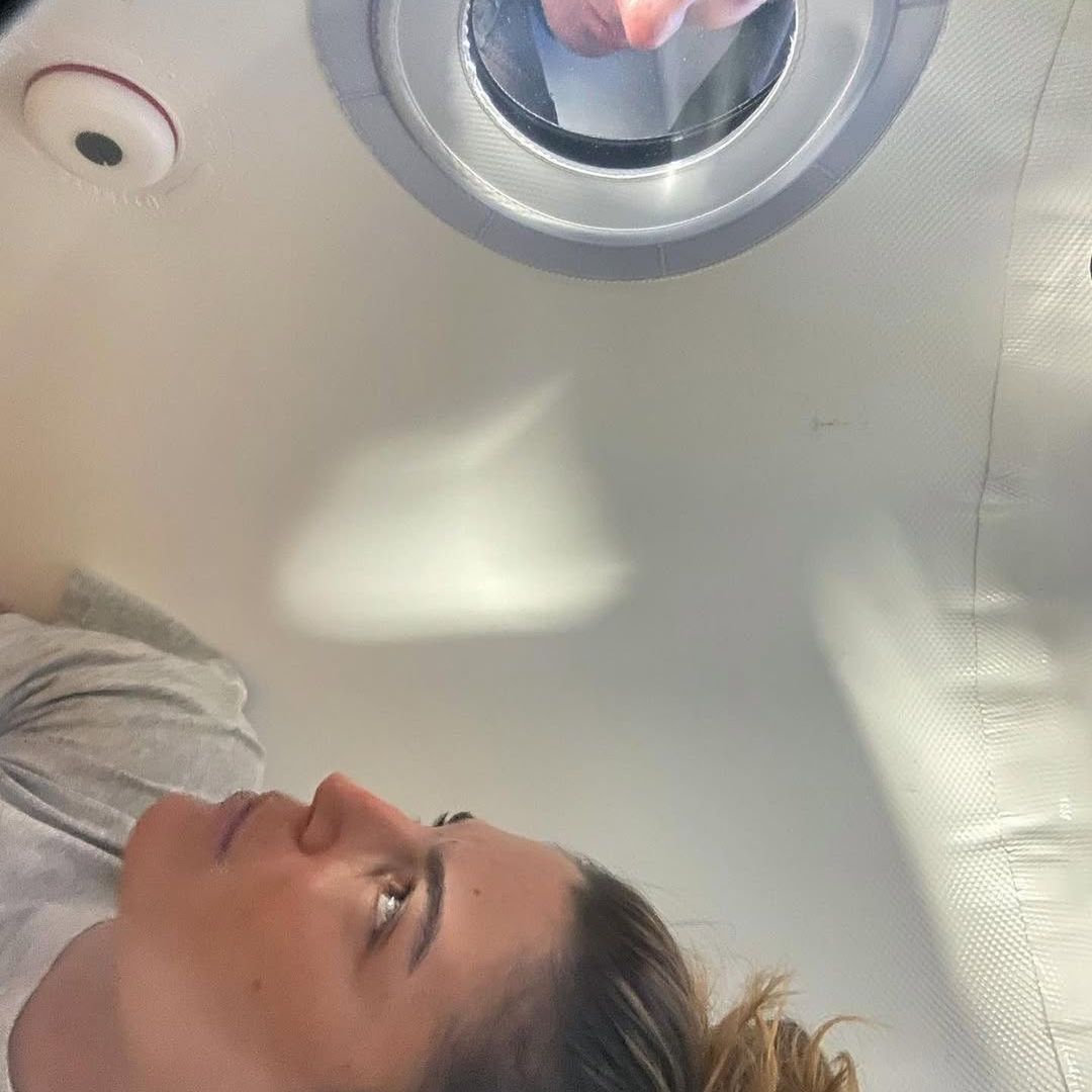 Inside view of Oxynova 8 chamber with lady taking sessions