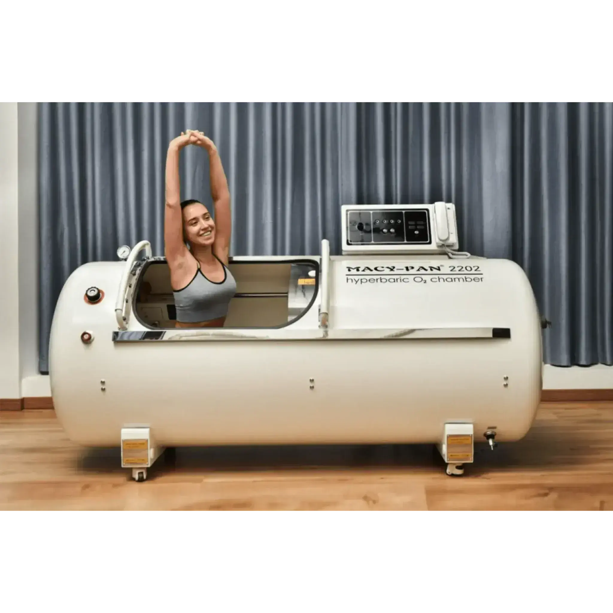Macy-Pan HP2202 hyperbaric oxygen chamber with a user stretching inside, promoting recovery and athletic performance.
