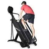 Male athlete demonstrating explosive rope pulling technique on RX4400 Spartan"