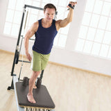 Man performing fitness routine on Merrithew SPX Max Plus Reformer bundle