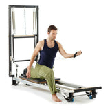 "Intense workout by man on Merrithew SPX Max Plus reformer bundle