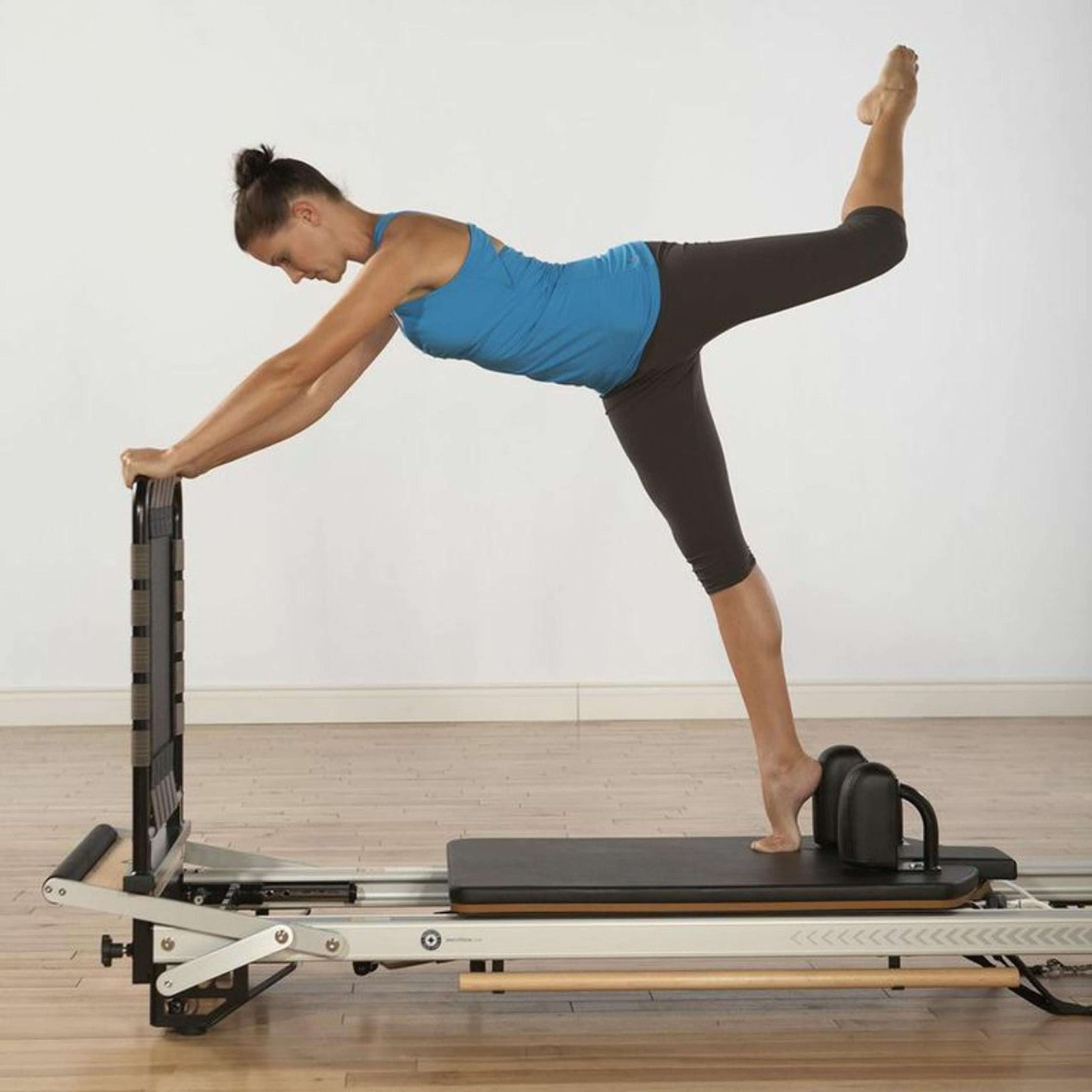 Female athlete doing core exercises on Merrithew SPX Max Reformer