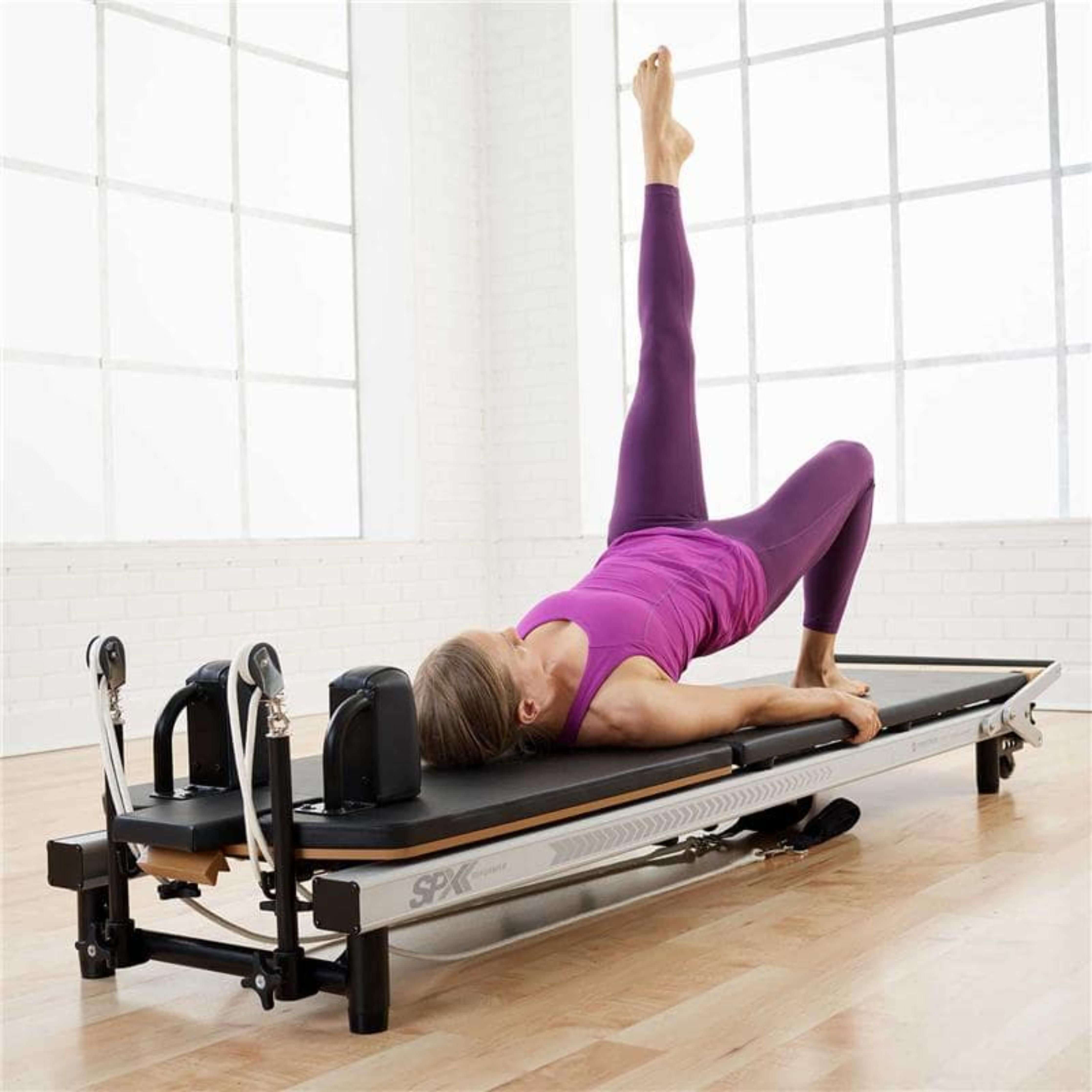 Female engaging in beginner-friendly routine on Merrithew SPX Max Reformer