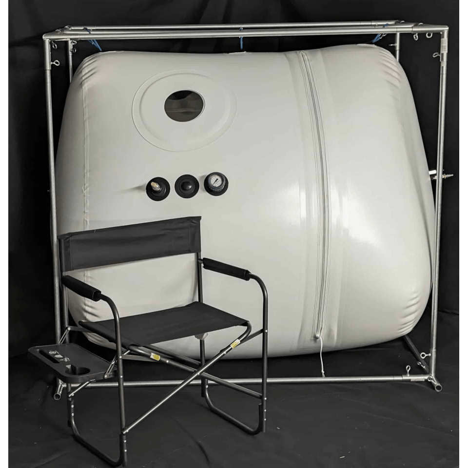 Newtowne 54" hyperbaric chamber with a chair for comfort, designed for therapeutic healing in a spacious, FDA-cleared tent.