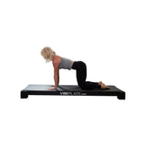 women doing yoga on vibeplate yogaplate