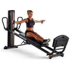 female model doing side extensions on Total Gym ELEVATE Encompass™ Pilates Package