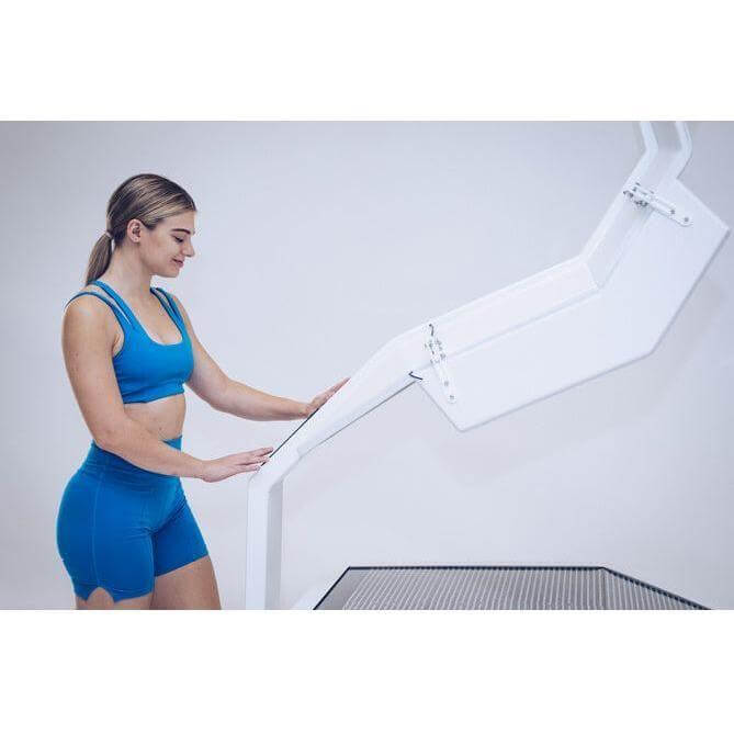 female model opening the OvationULT Red Light Therapy Bed by Body Balance System