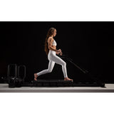 girl doing plank on mini pro lagree