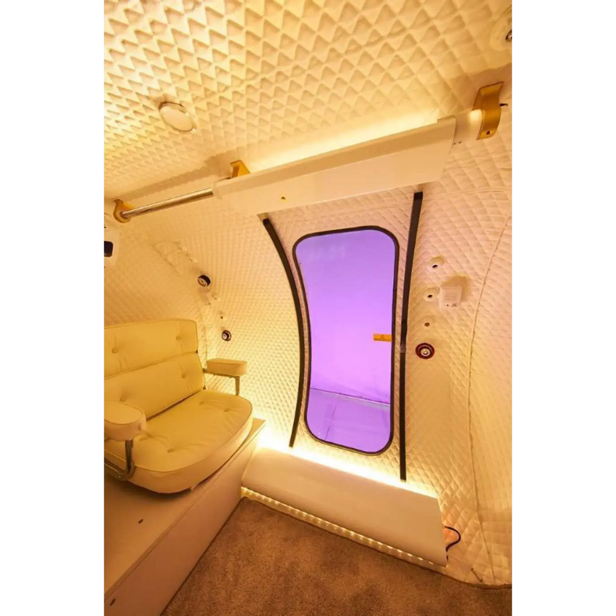Interior of Macy-Pan HE5000 hyperbaric oxygen therapy chamber with spacious seating and sliding door.