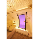 Interior of Macy-Pan HE5000 hyperbaric oxygen therapy chamber with spacious seating and sliding door.