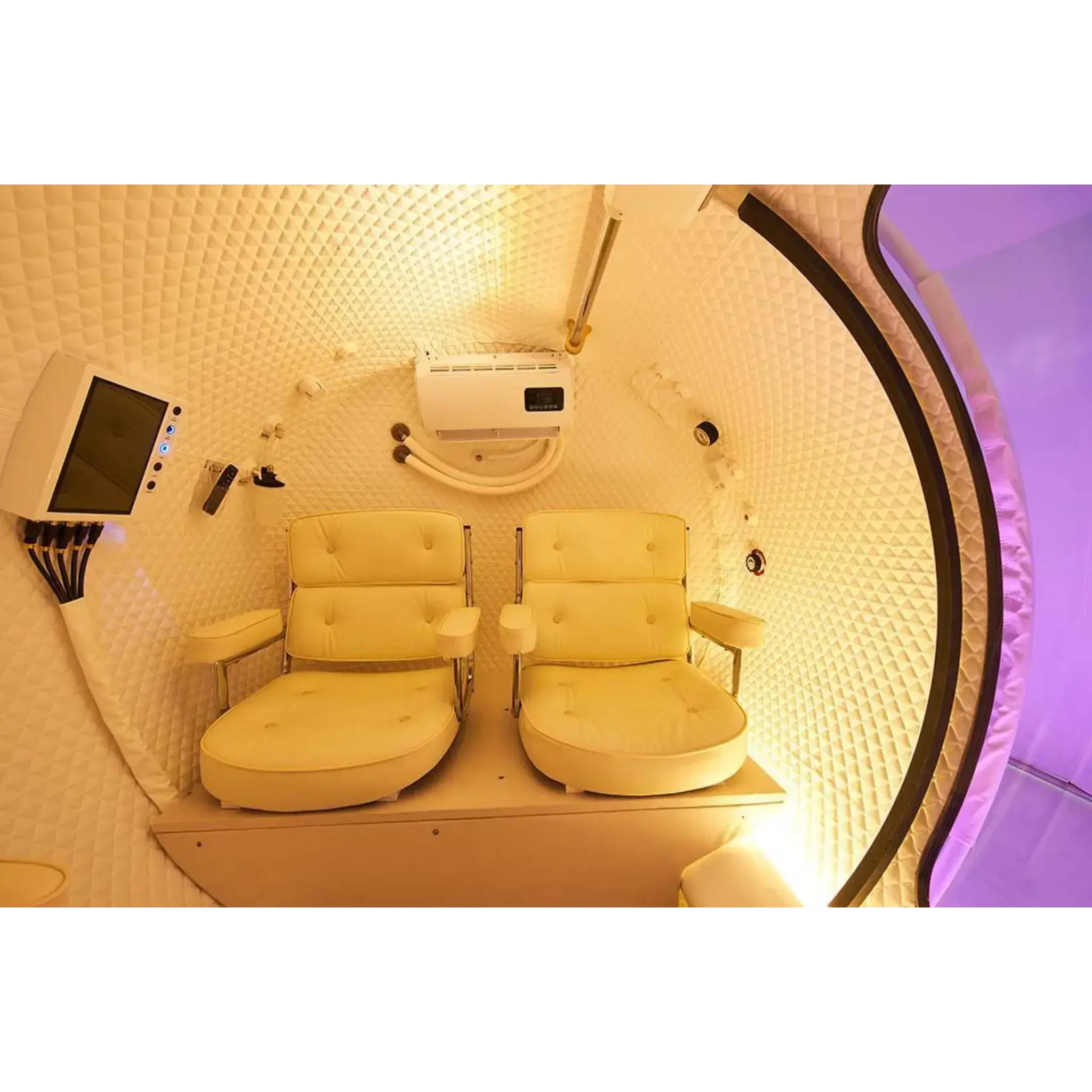 Interior of Macy-Pan Hyperbaric Oxygen Therapy Chamber HE5000 with two comfortable chairs.