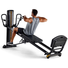 male model doing arm exercise on encompass pilates machine