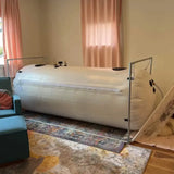 newtowne c4‑40 hyperbaric chamber in a cozy room, featuring spacious design for home oxygen therapy and recovery.