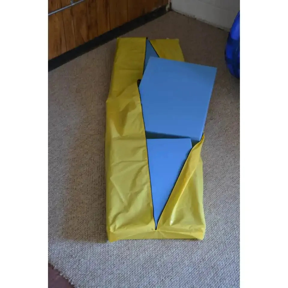 Newtowne Hyperbarics C4-40 hyperbaric chamber components with a yellow cover and blue foam pieces.