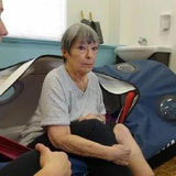 Senior client using oxynova 7 hyperbaric chamber during therapy session