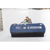 women and child beside Oxynova 8 chamber