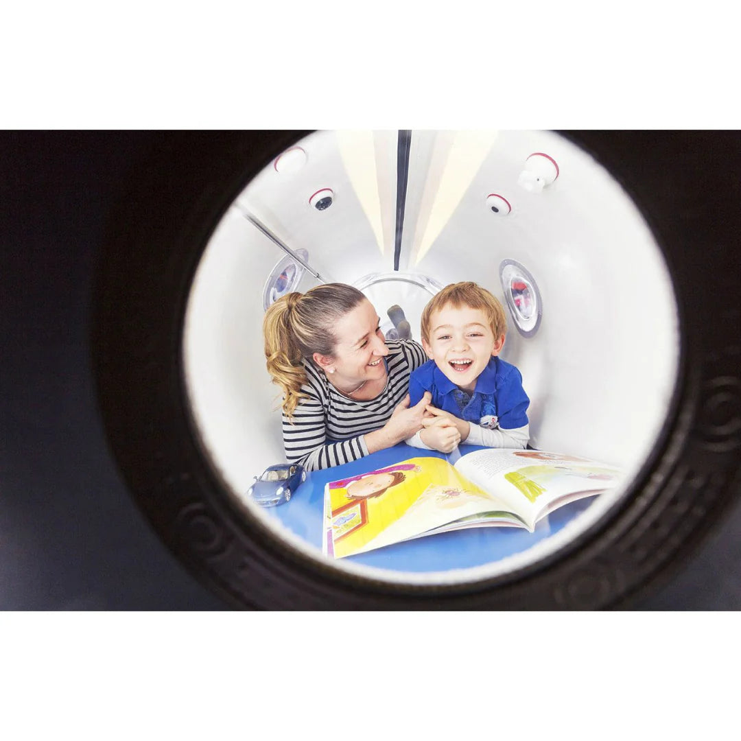 women and child inside of Oxynova 8 chamber showcasing its sitting capicity