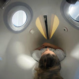 women lying down inside of Oxynova 8 chamber