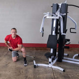 man working out on body solid exm3000lps home gym