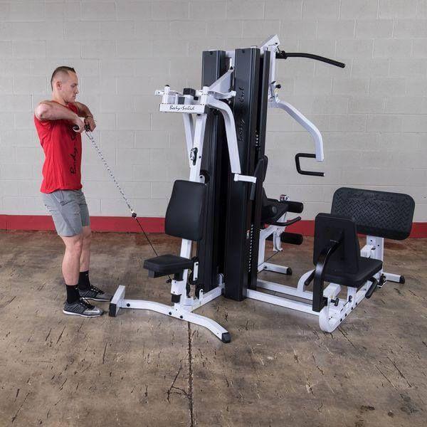 man doing arm exercises on body solid exm 3000 lps