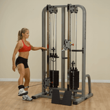 Female performing a leg exercise on the Body-Solid Pro Clubline Dual Cable Column SDC2000G black fitness equipment - RecovAthlete
