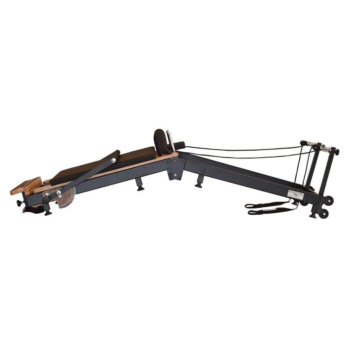 Premium foldable metal Pilates reformer with wooden frame for strength and wellness training.
