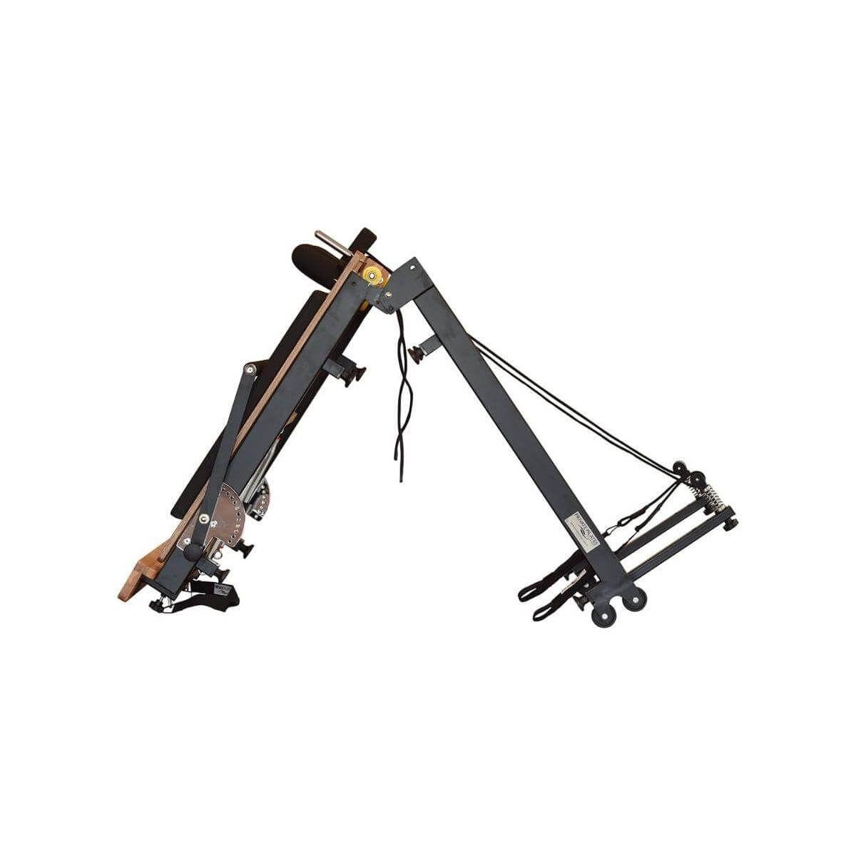 Foldable metal Pilates reformer showing adjustable components for strength and rehabilitation exercises.