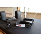 Close-up of Private Pilates reformer straps showing high-quality craftsmanship and comfort features.