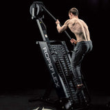 Male athlete performing rope climbing workout on RX4400 Spartan at 60-degree incline"