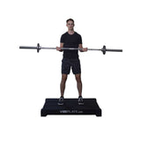 Male model with barbell on VibePlate 3048 Whole Body Vibration Machines