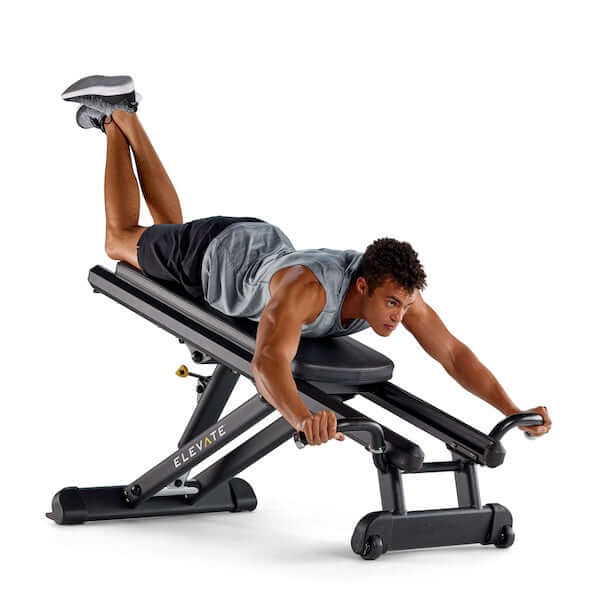 Male model working out on Total Gym ELEVATE Press Trainer