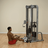Male performing a rowing exercise on the Body-Solid Pro Clubline Dual Cable Column SDC2000G black fitness equipment - RecovAthlete