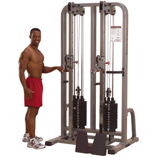 Male standing beside the Body-Solid Pro Clubline Dual Cable Column SDC2000G