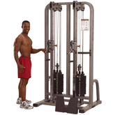 Male standing beside the Body-Solid Pro Clubline Dual Cable Column SDC2000G