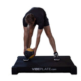 Man streching on VibePlate 3048 Whole Body Vibration Machines