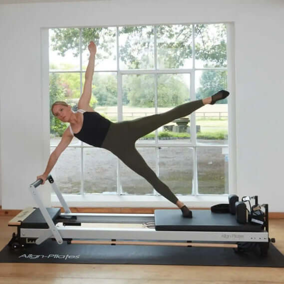 Instructor demonstrating exercise on Align Pilates C8 Pro