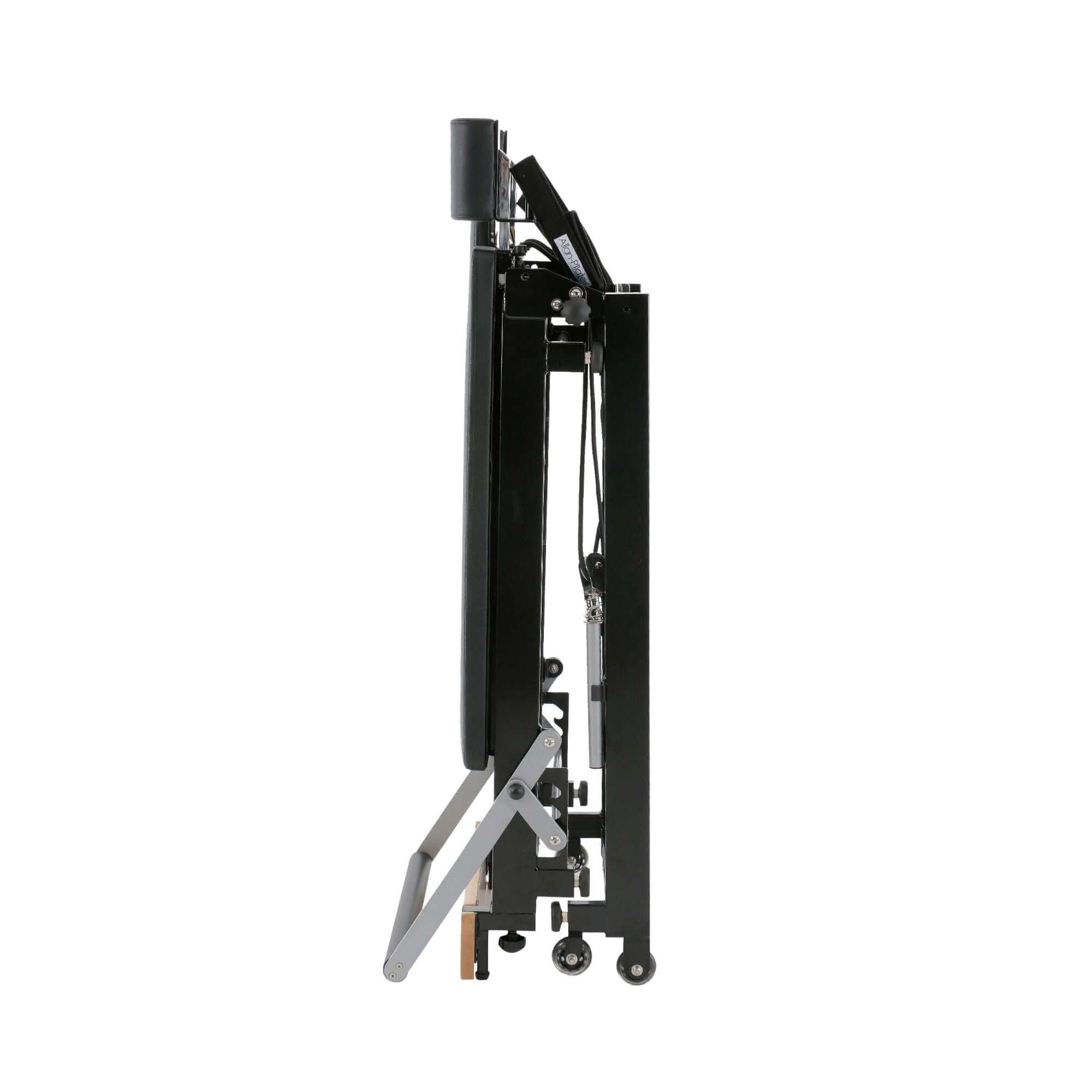 Perspective view of Align Pilates F2 Reformer, focusing on its sleek metal frame and elegant lines.