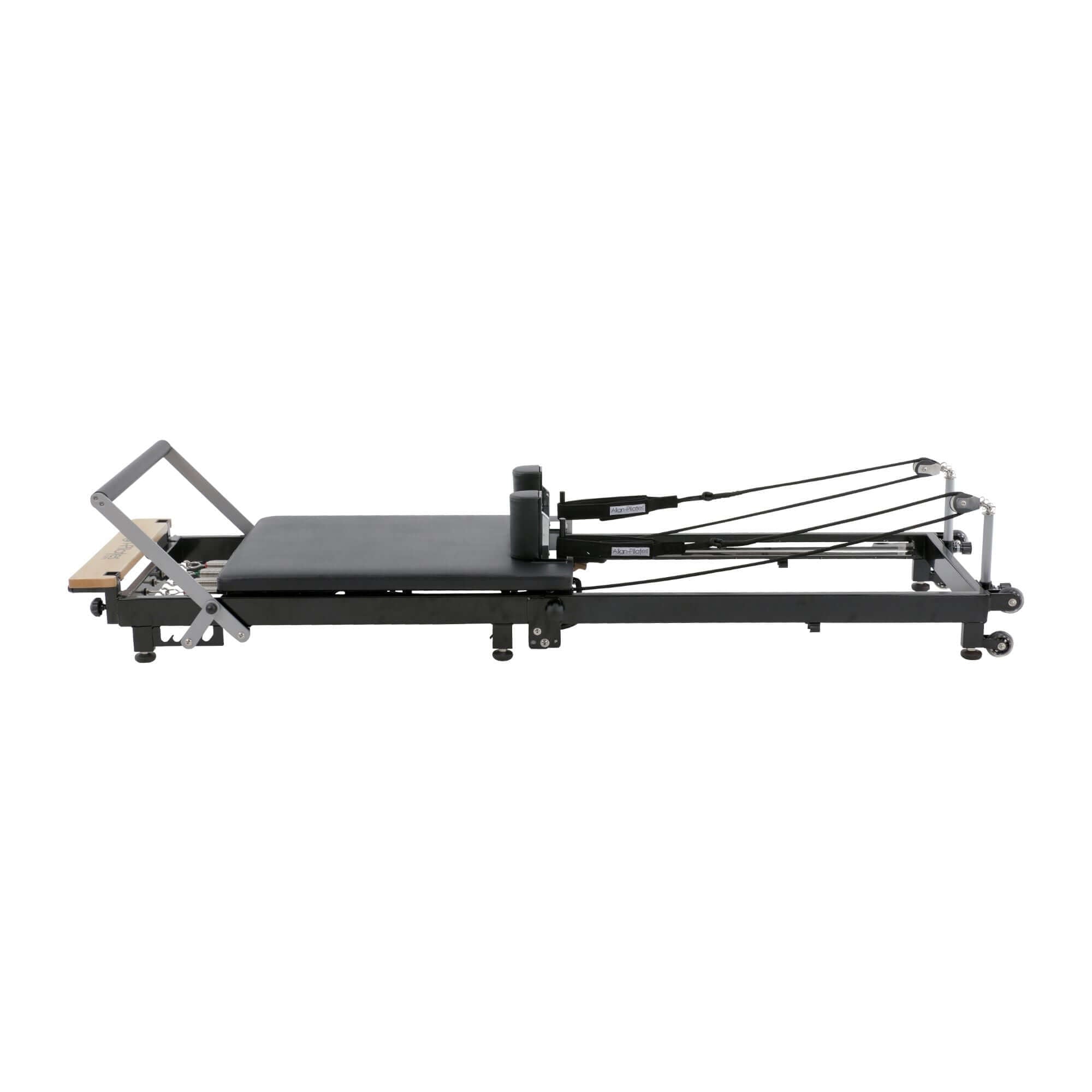 Image of an Align Pilates F2 folding reformer, highlighting its adjustable parts and sturdy frame for pilates exercises.