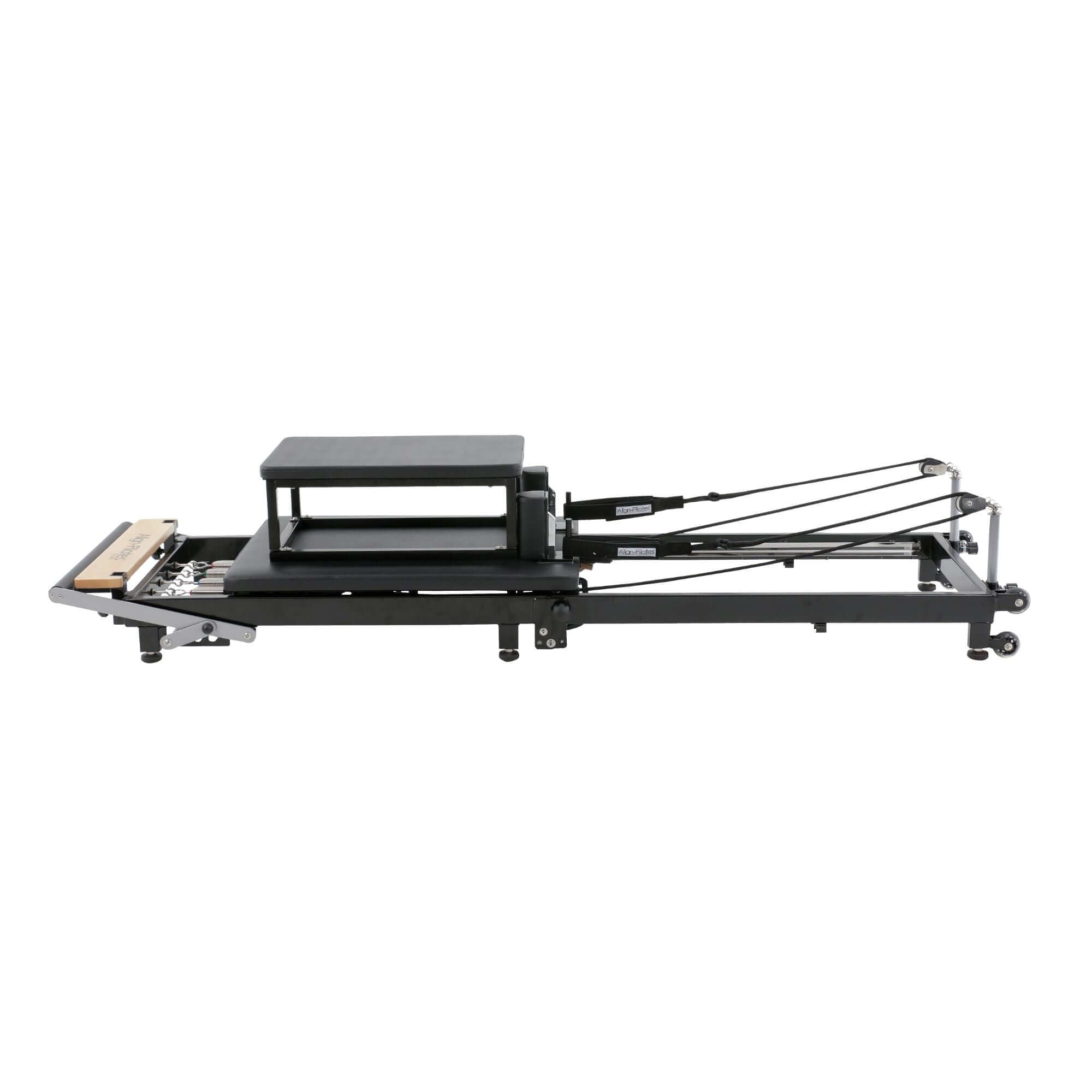 Align Pilates F2 machine with its accessories, like resistance springs and ropes, displayed for a complete workout setup.