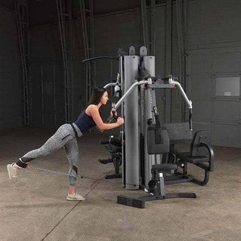 girl working out on body solid g9s 