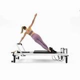 Fitness enthusiast using Align Pilates C8 Pro Reformer Machine